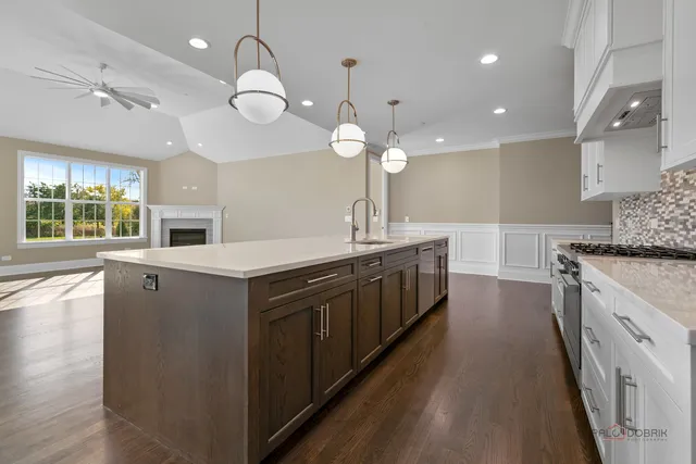 a stove top oven sitting inside of a kitchen