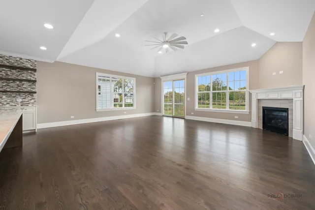 a view of kitchen and living room with a fireplace