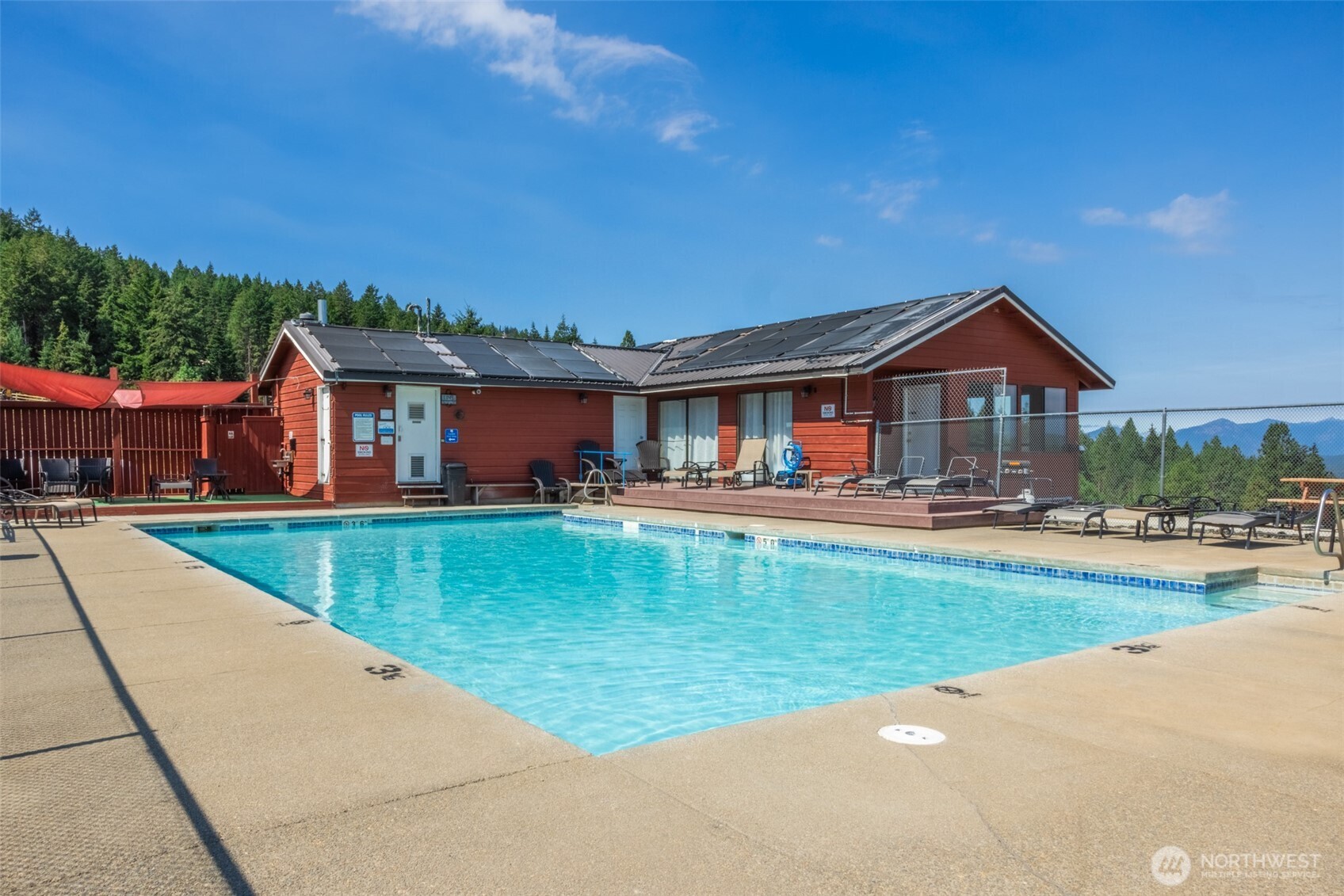451 Aspen Springs Road Cle Elum, WA 98922 - Photo 28 of 31 a front view of a house with swimming pool having outdoor seating