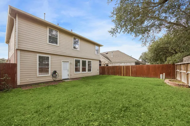 a house view with a garden space