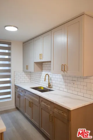 a kitchen with a stove and a sink