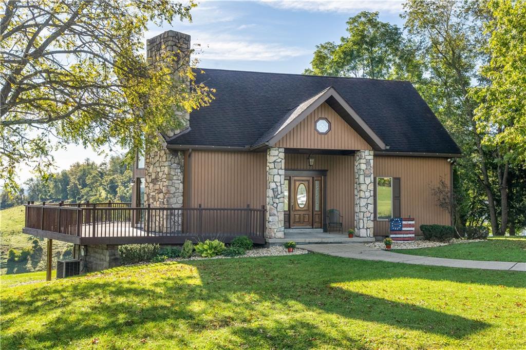 a front view of a house with a yard table and chairs