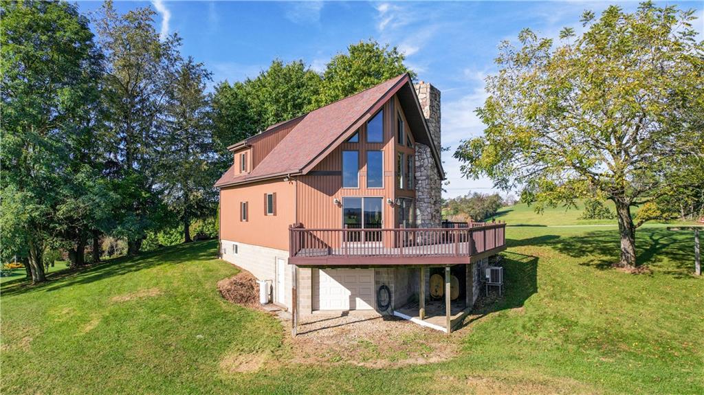 58 Happy Valley Road Perryopolis, PA 15473 - Photo 3 of 25 a view of a house with a yard porch and sitting area