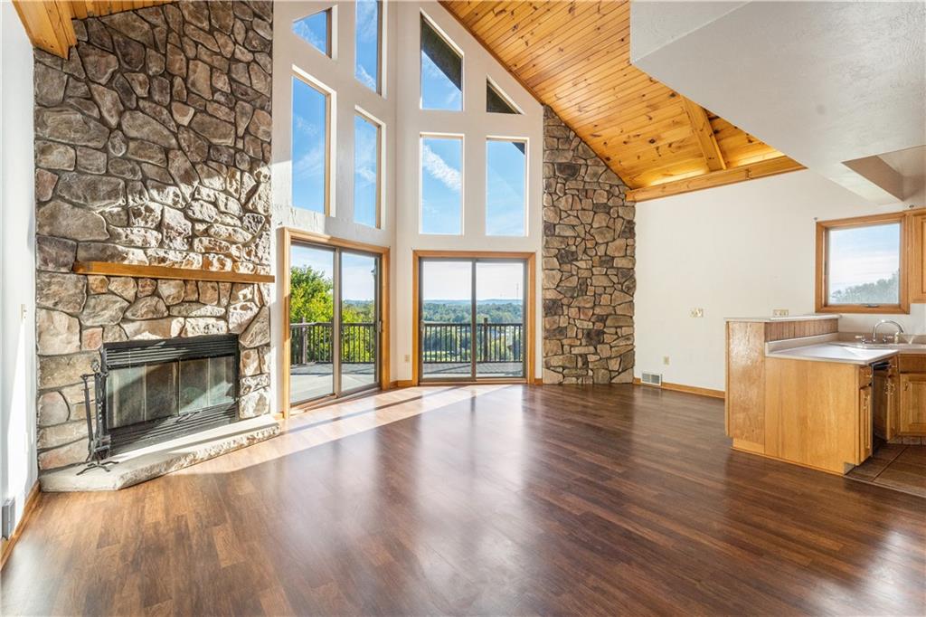 58 Happy Valley Road Perryopolis, PA 15473 - Photo 5 of 25 a view of an empty room with wooden floor and a fireplace