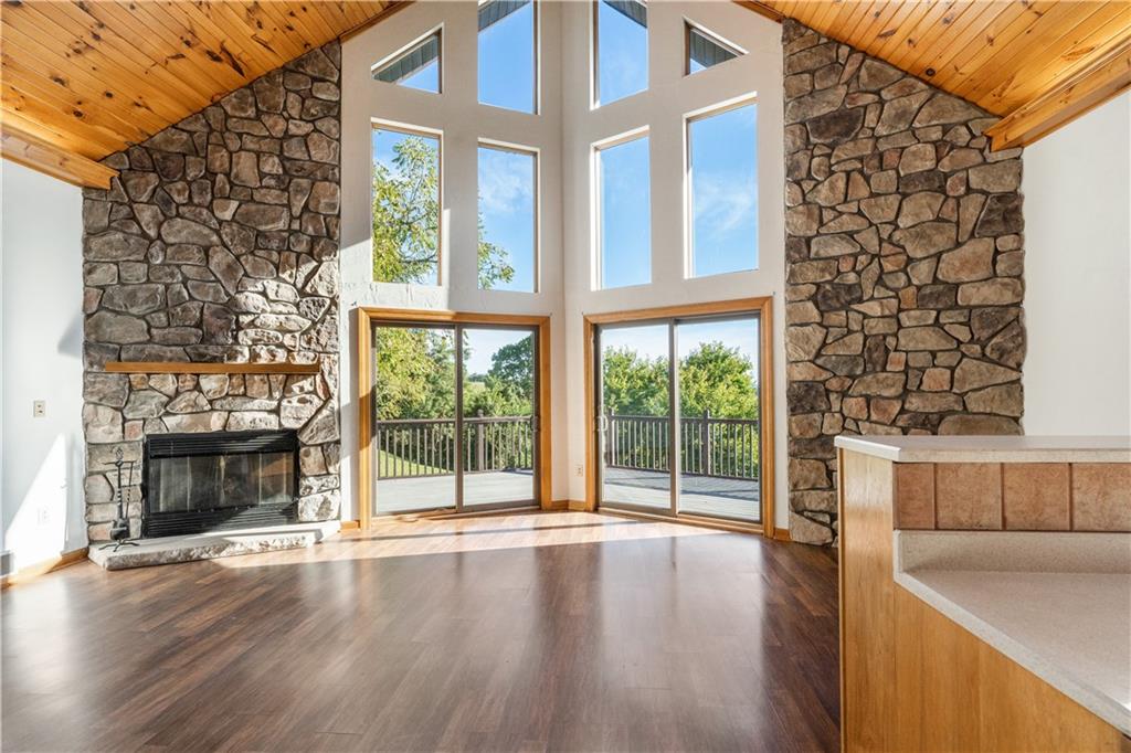 58 Happy Valley Road Perryopolis, PA 15473 - Photo 7 of 25 a view of an empty room with wooden floor and a fireplace