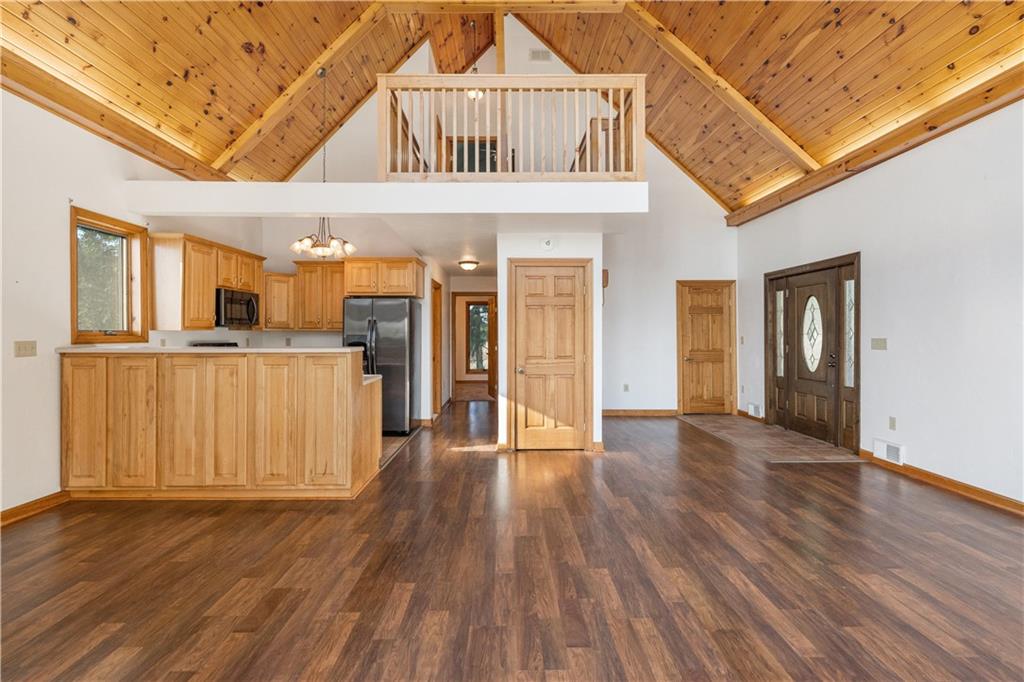 58 Happy Valley Road Perryopolis, PA 15473 - Photo 9 of 25 a view of a hallway with wooden floor and a kitchen
