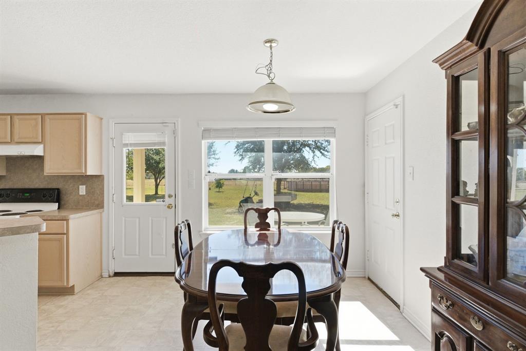 2710 Fairview Road Millsap, TX 76066 - Photo 11 of 40 a view of a dining room with furniture window and outside view