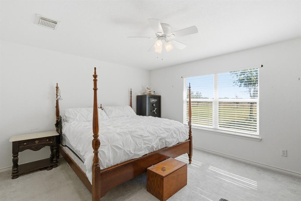 2710 Fairview Road Millsap, TX 76066 - Photo 14 of 40 a bed room with a bed and a window