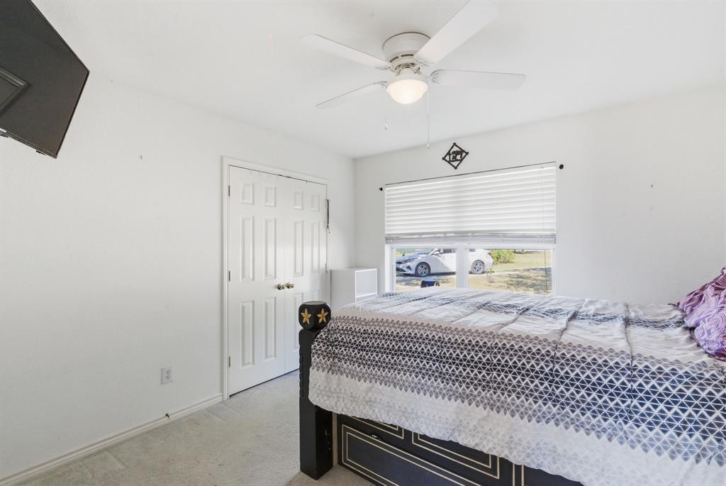 2710 Fairview Road Millsap, TX 76066 - Photo 19 of 40 a bedroom with a bed and a window
