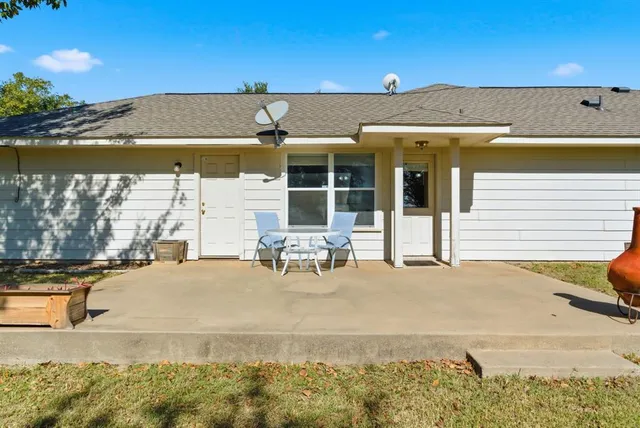 a view of a patio with swimming pool table and chairs