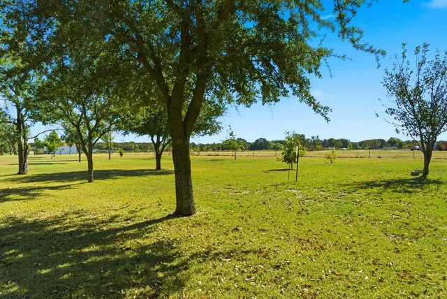 a view of an ocean with a yard