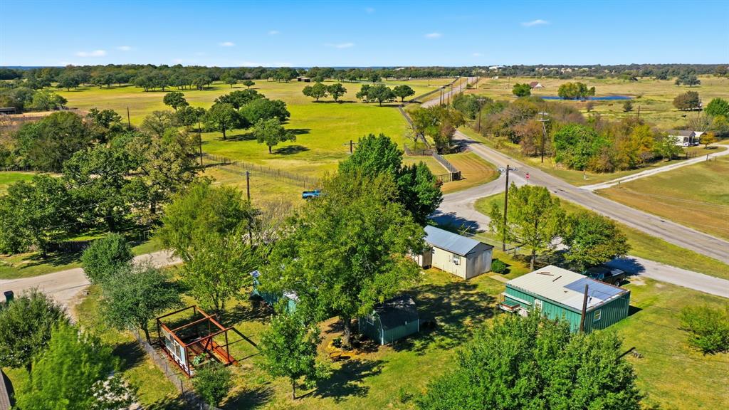 2710 Fairview Road Millsap, TX 76066 - Photo 39 of 40 an aerial view of ocean with residential house with outdoor space and trees