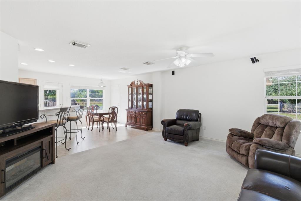 2710 Fairview Road Millsap, TX 76066 - Photo 4 of 40 a living room with furniture and a flat screen tv