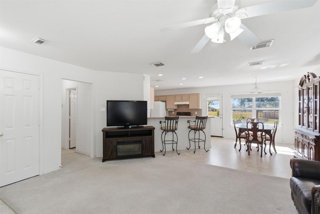 2710 Fairview Road Millsap, TX 76066 - Photo 7 of 40 a living room with furniture and a flat screen tv