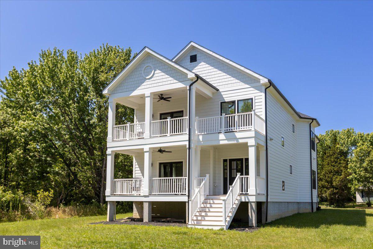 219 Utah Road Stevensville, MD 21666 - Photo 1 of 36 a front view of a house with a yard