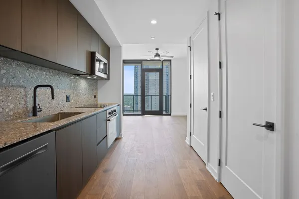 a kitchen with a sink and refrigerator