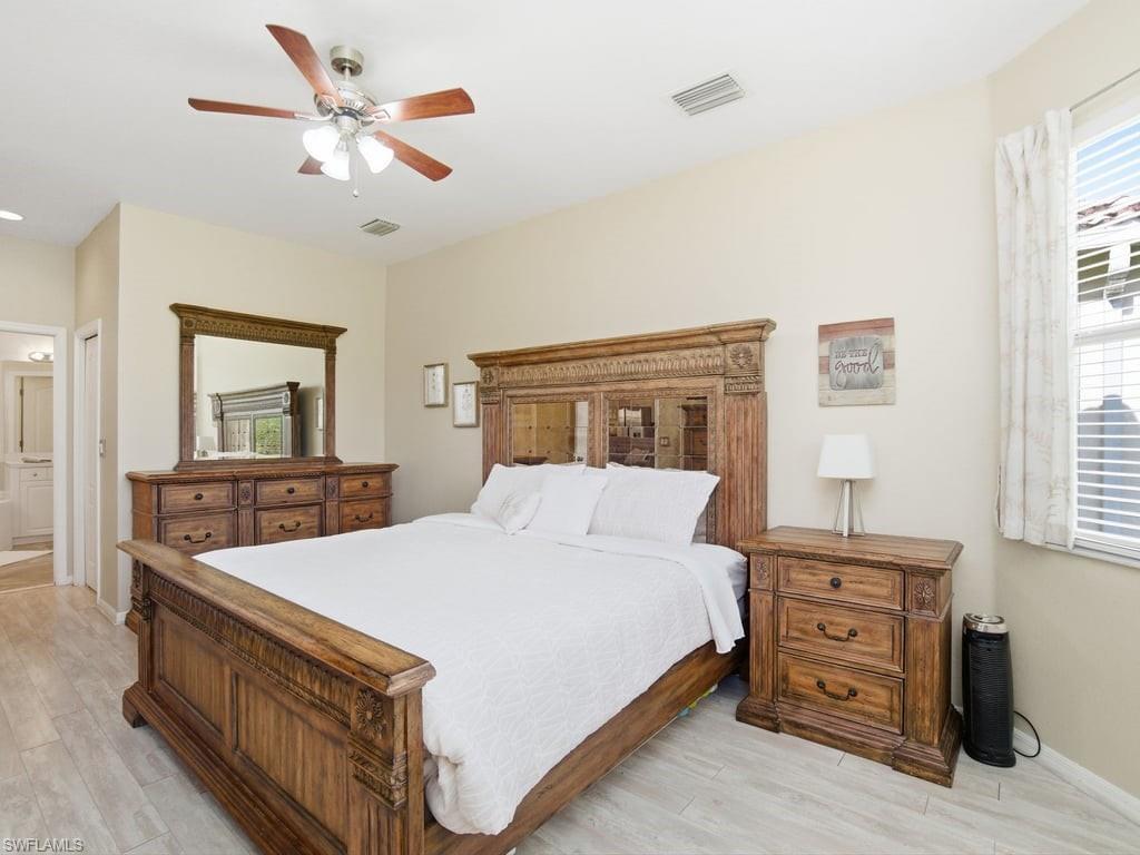12719 Stone Tower Loop Fort Myers, FL 33913 - Photo 21 of 45 a bedroom with a bed and a dresser
