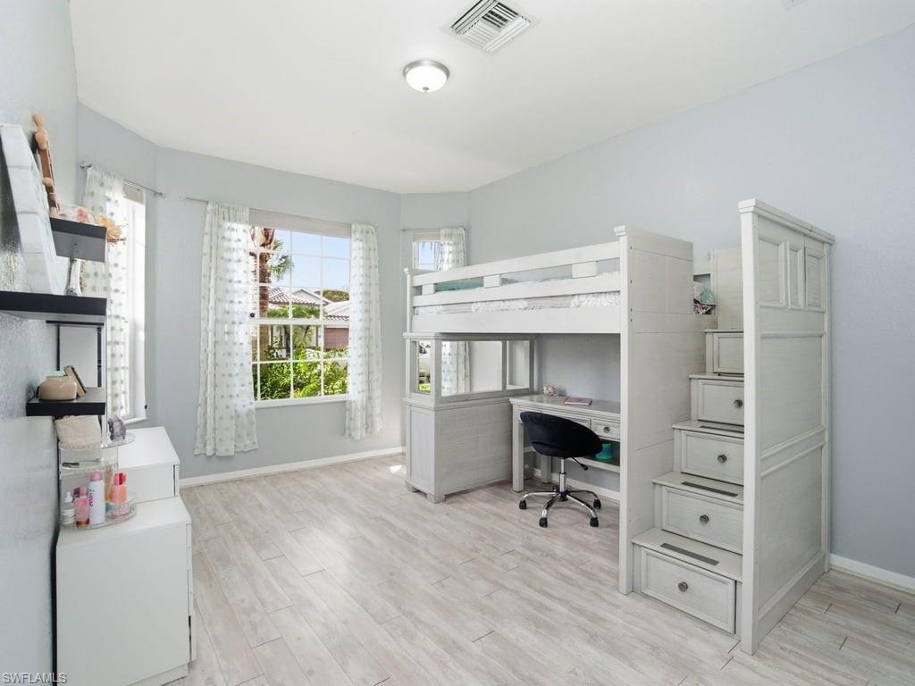 12719 Stone Tower Loop Fort Myers, FL 33913 - Photo 25 of 45 a bedroom with a bed and a window