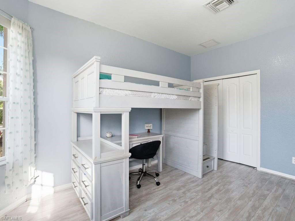12719 Stone Tower Loop Fort Myers, FL 33913 - Photo 26 of 45 a workspace with a wooden closet