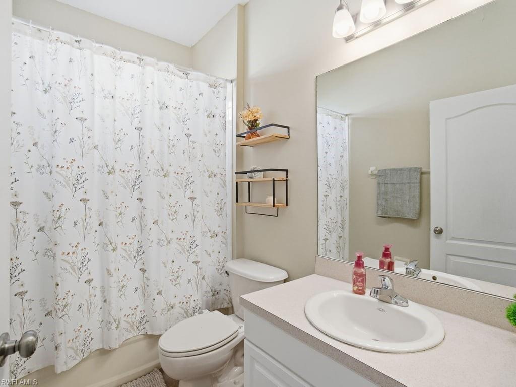 12719 Stone Tower Loop Fort Myers, FL 33913 - Photo 27 of 45 a bathroom with a sink toilet and mirror