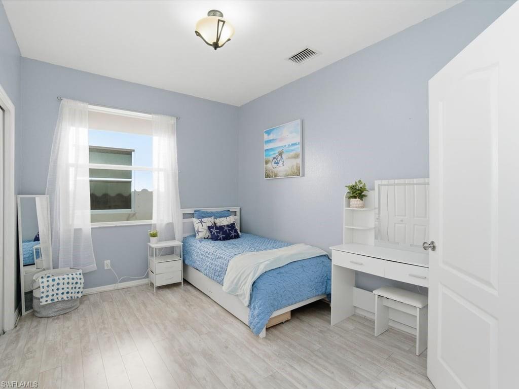12719 Stone Tower Loop Fort Myers, FL 33913 - Photo 28 of 45 a bedroom with a bed and a window