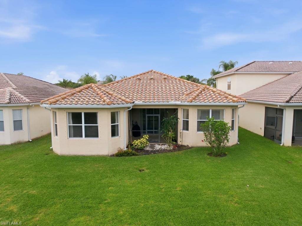 12719 Stone Tower Loop Fort Myers, FL 33913 - Photo 32 of 45 a front view of a house with garden