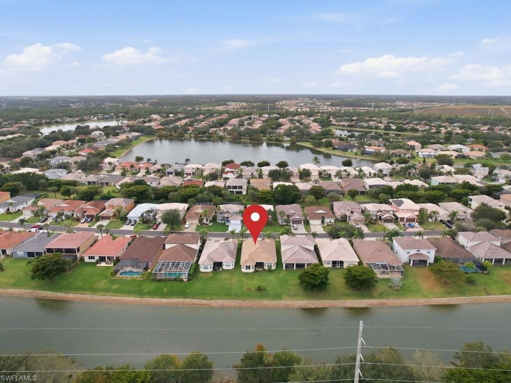 12719 Stone Tower Loop Fort Myers, FL 33913 - Photo 37 of 45 an aerial view of a city with lots of residential buildings lake and ocean view