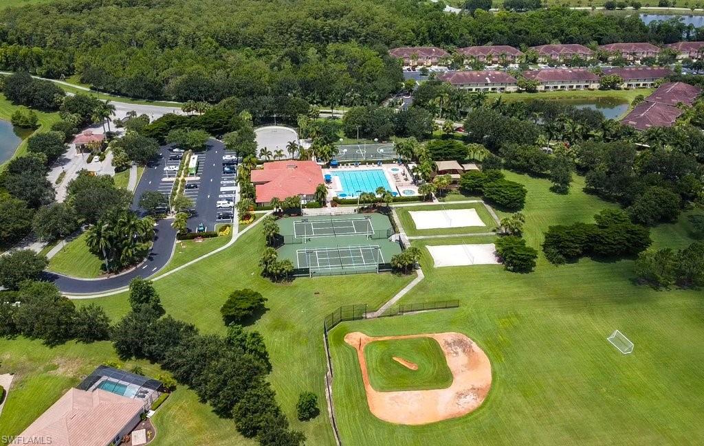 12719 Stone Tower Loop Fort Myers, FL 33913 - Photo 38 of 45 an aerial view of a house with swimming pool tennis courts and ocean view