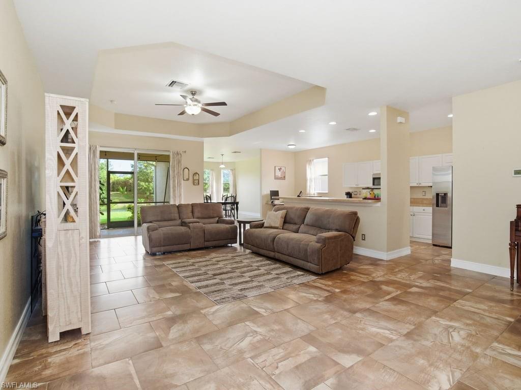 12719 Stone Tower Loop Fort Myers, FL 33913 - Photo 4 of 45 a living room with furniture and a large window