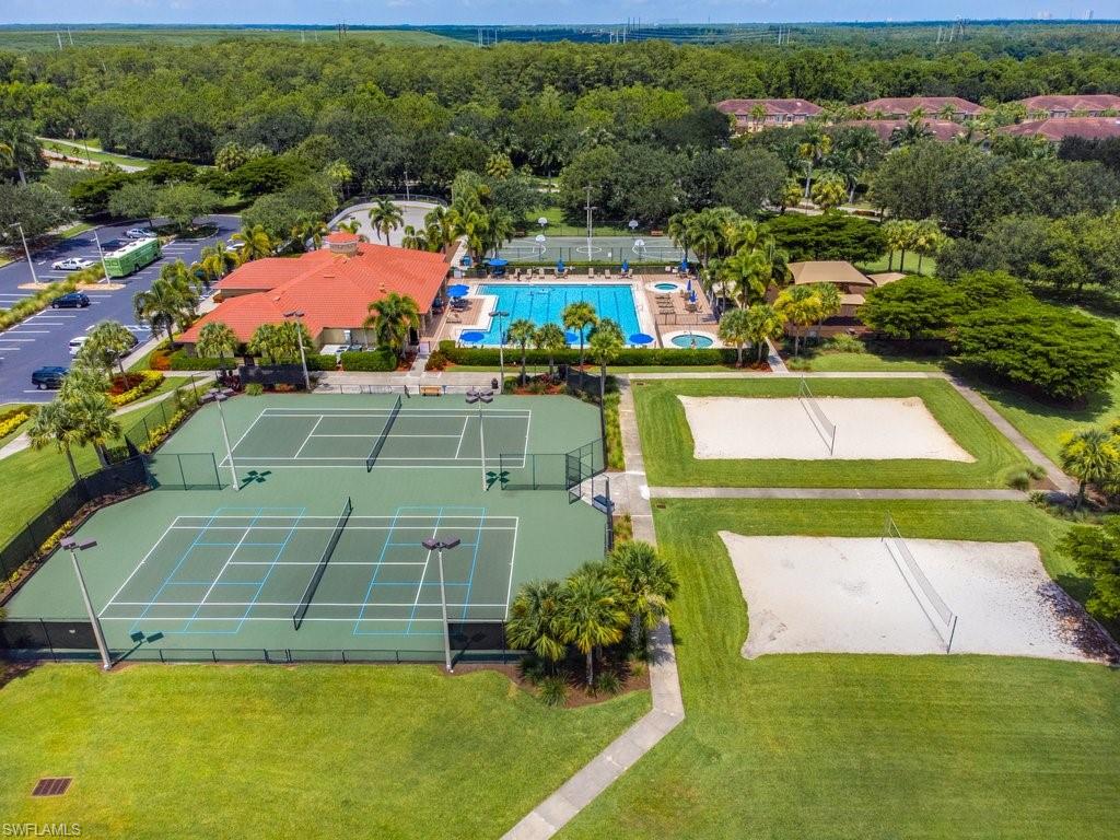 12719 Stone Tower Loop Fort Myers, FL 33913 - Photo 41 of 45 a view of a tennis ground with large trees