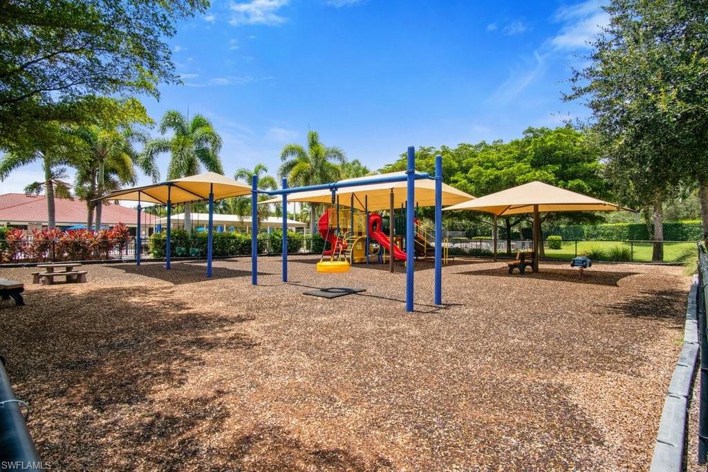 12719 Stone Tower Loop Fort Myers, FL 33913 - Photo 42 of 45 a view of park with large trees and table