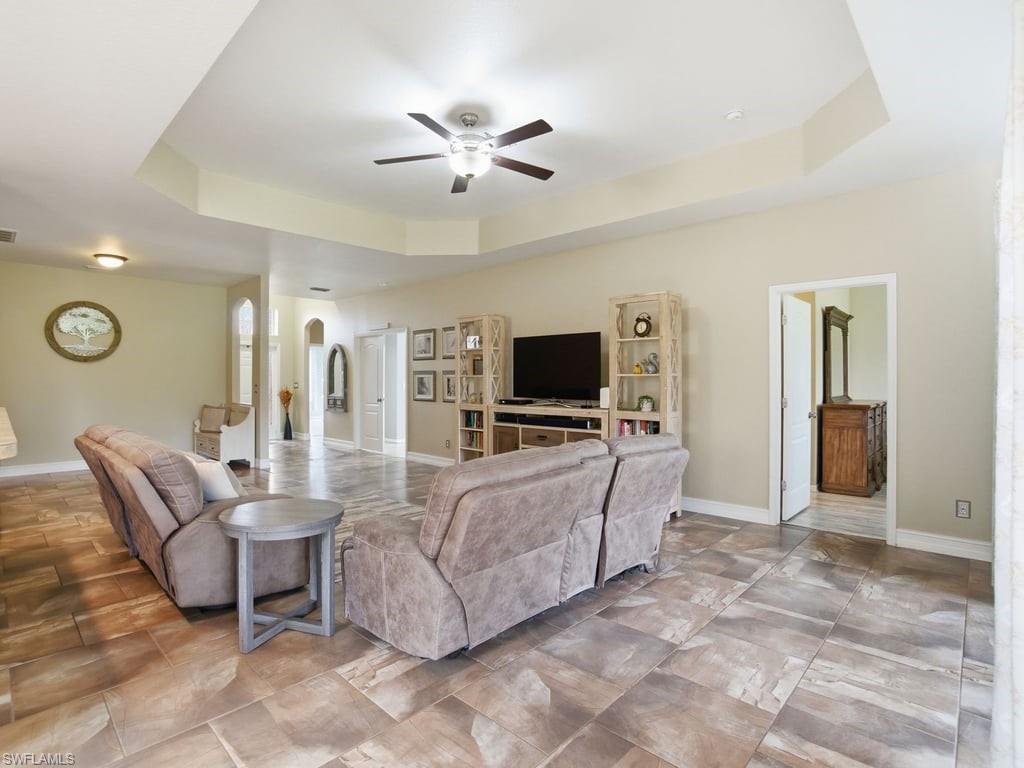 12719 Stone Tower Loop Fort Myers, FL 33913 - Photo 6 of 45 a living room with furniture and a flat screen tv