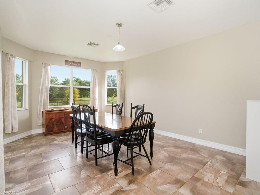 12719 Stone Tower Loop Fort Myers, FL 33913 - Photo 9 of 45 a view of a dining room with furniture window and outside view