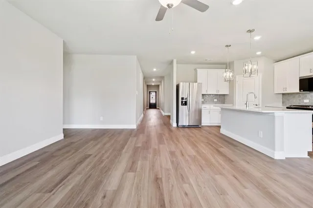 a view of kitchen with wooden floor