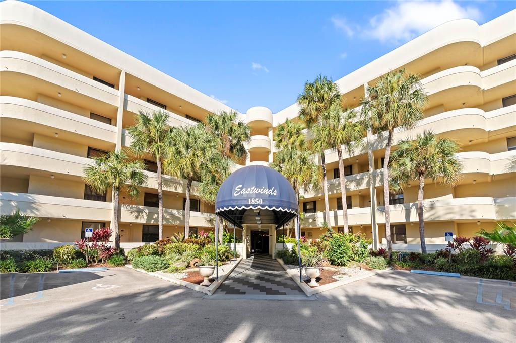 1850 Homewood Boulevard, Unit 512 Delray Beach, FL 33445 - Photo 1 of 43 a view of a brick building with a large windows