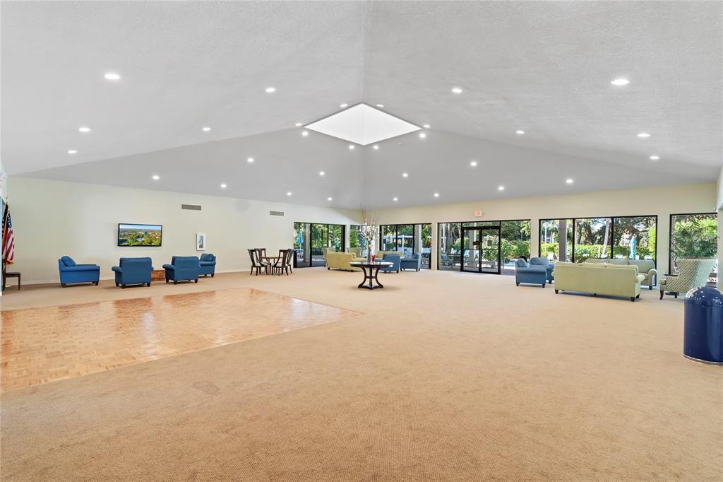 1850 Homewood Boulevard, Unit 512 Delray Beach, FL 33445 - Photo 31 of 43 a view of an empty room with a table and chairs