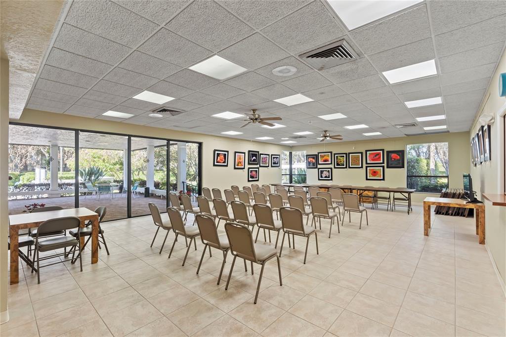 1850 Homewood Boulevard, Unit 512 Delray Beach, FL 33445 - Photo 32 of 43 a living room with lots of furniture and a large window