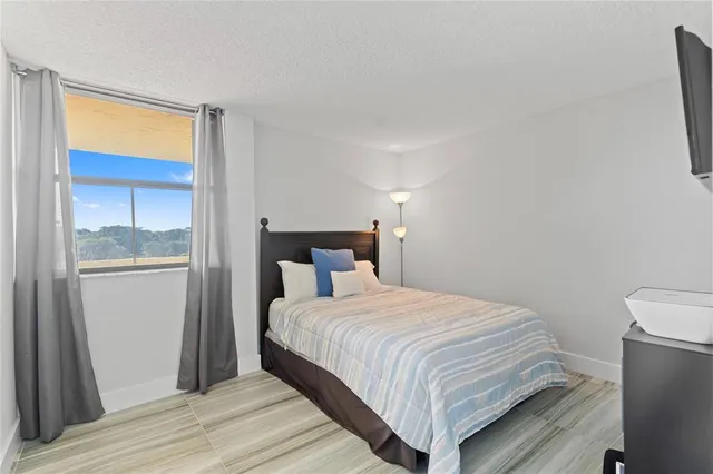 a bedroom with a bed and a closet