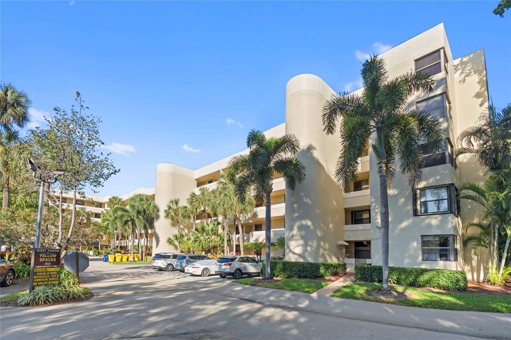1850 Homewood Boulevard, Unit 512 Delray Beach, FL 33445 - Photo 41 of 43 a view of a street with tall buildings