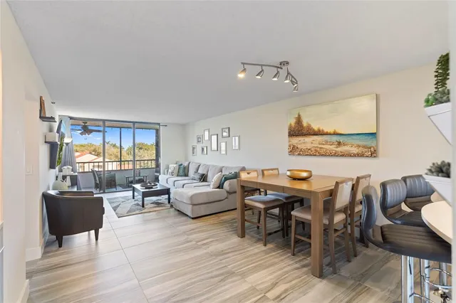 a living room with lots of furniture and wooden floor