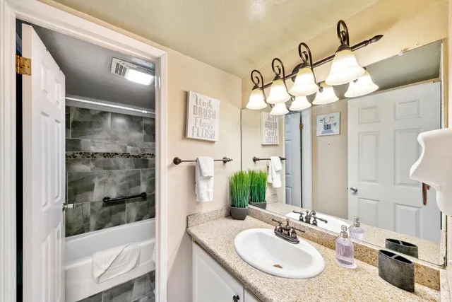 a bed room with a bed furniture and a lamp