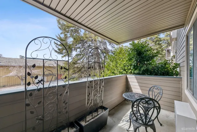 an aerial view of house with yard swimming pool and outdoor seating