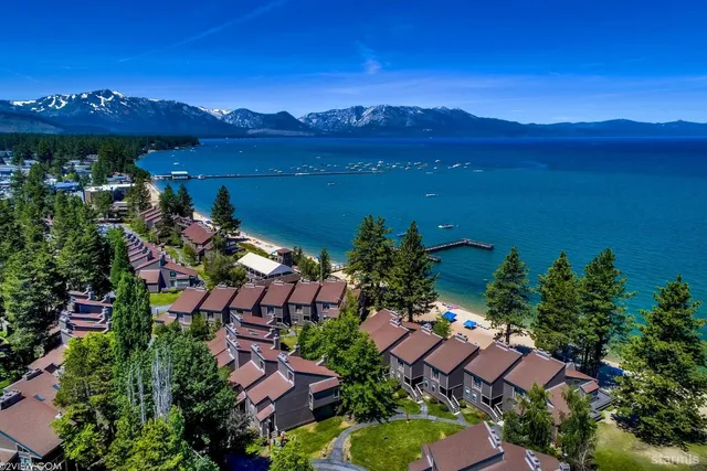 a view of a lake with a house in the background