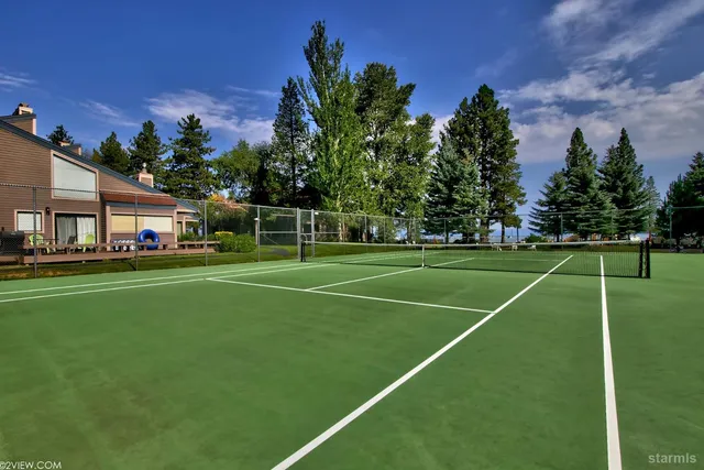 a room with gym equipment and a flat screen tv