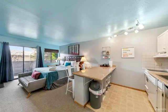 a kitchen with cabinets and window