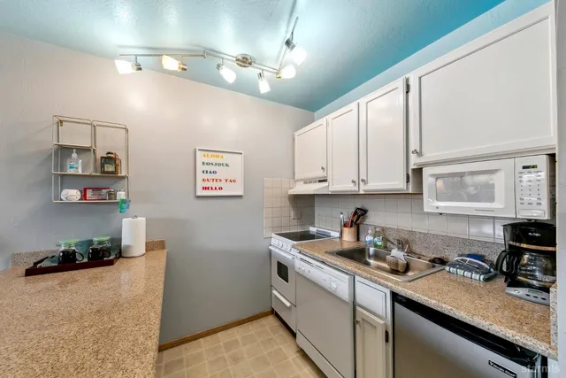 a kitchen with a sink and cabinets