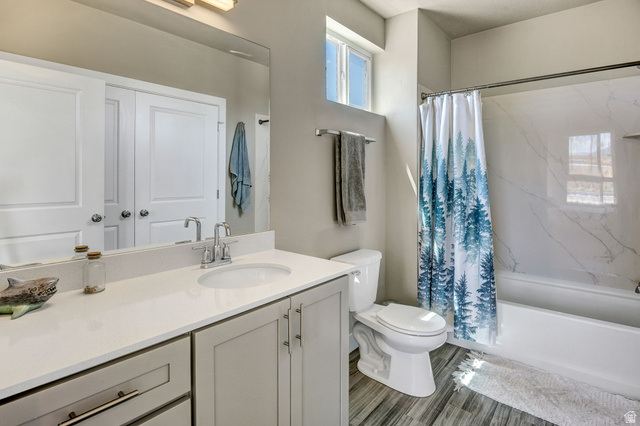 2101 North Main Street, Unit 306 Sunset, UT 84015 - Photo 14 of 22 Bathroom featuring a vanity with an integrated sink, light-toned countertop, and light gray cabinetry