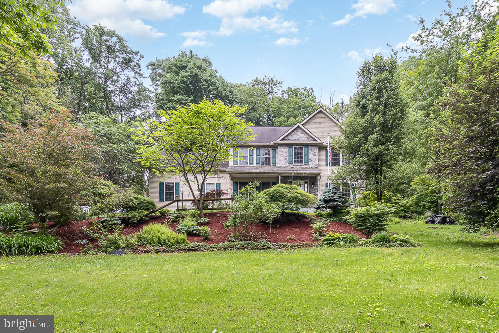 316 House Rock Road Pequea, PA 17565 - Photo 1 of 21 a house view with a garden space