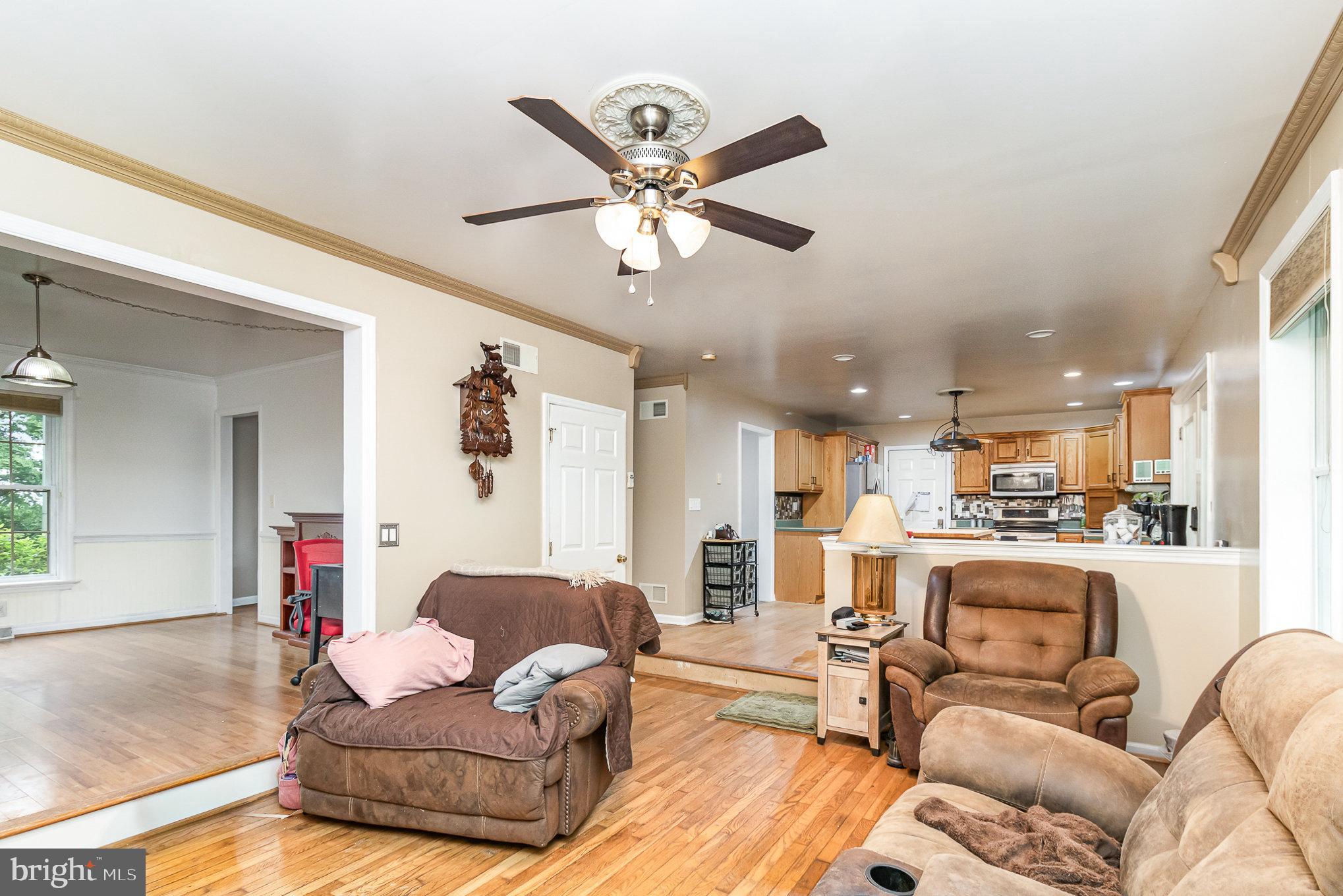 316 House Rock Road Pequea, PA 17565 - Photo 6 of 21 a living room with furniture kitchen view and a chandelier