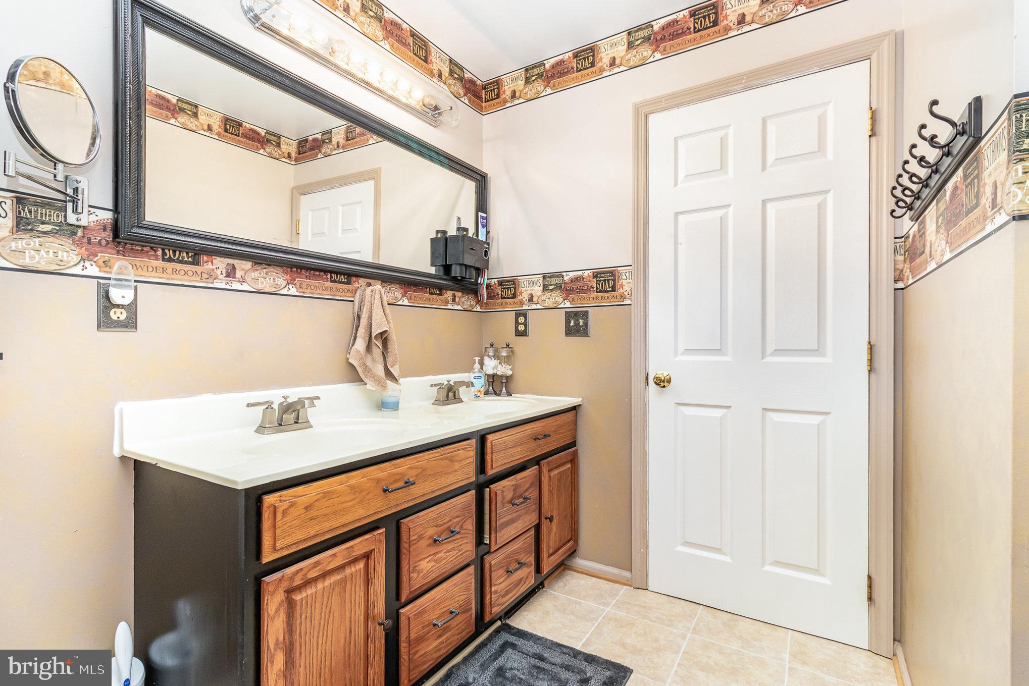 316 House Rock Road Pequea, PA 17565 - Photo 8 of 21 a bathroom with a sink and a mirror